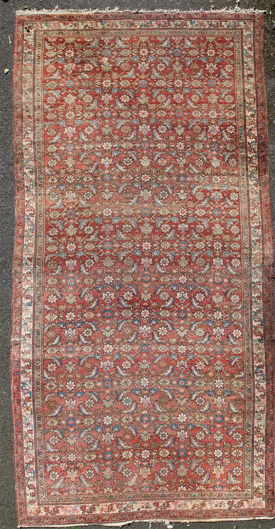 A north west Persian carpet, 14ft by 6ft 10in.